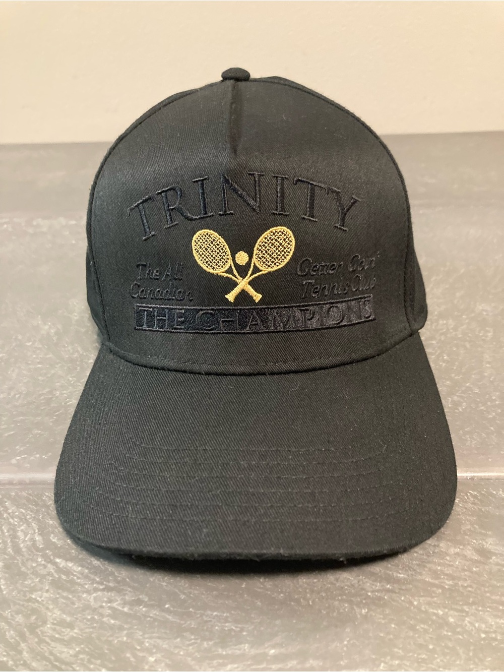 Trinity Black hat  with Gold Tennis Crest